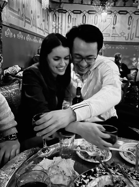 A cozy dinner out, mid laugh