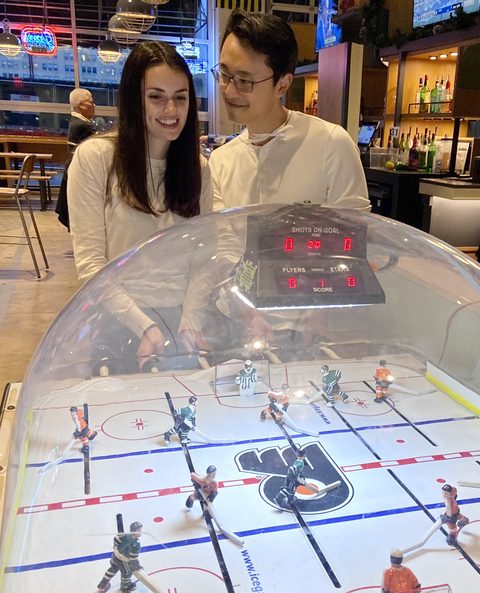 Playing bubble hockey at the arcade