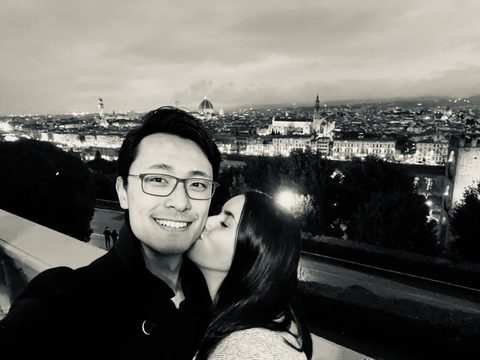 A kiss above the city at dusk