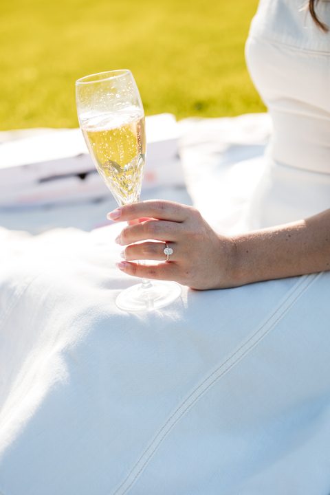 A champagne glass and the engagement ring